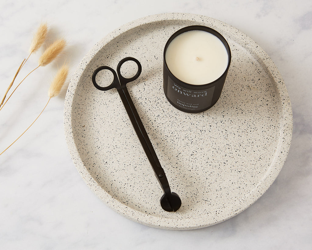 Black stainless steel candle wick trimmers used for candle safety