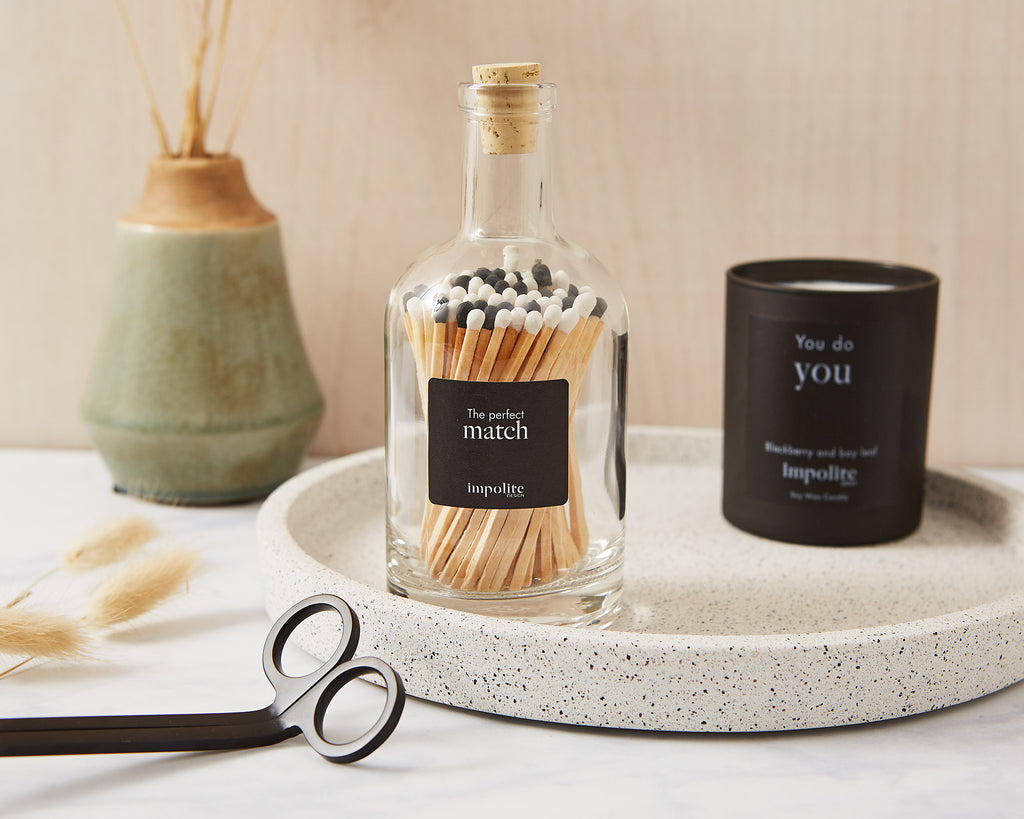 Glass Bottle of stylish black and white coloured extra long safety matches for candles